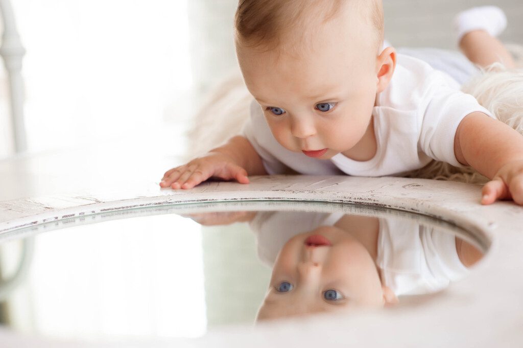 Baby with a mirror