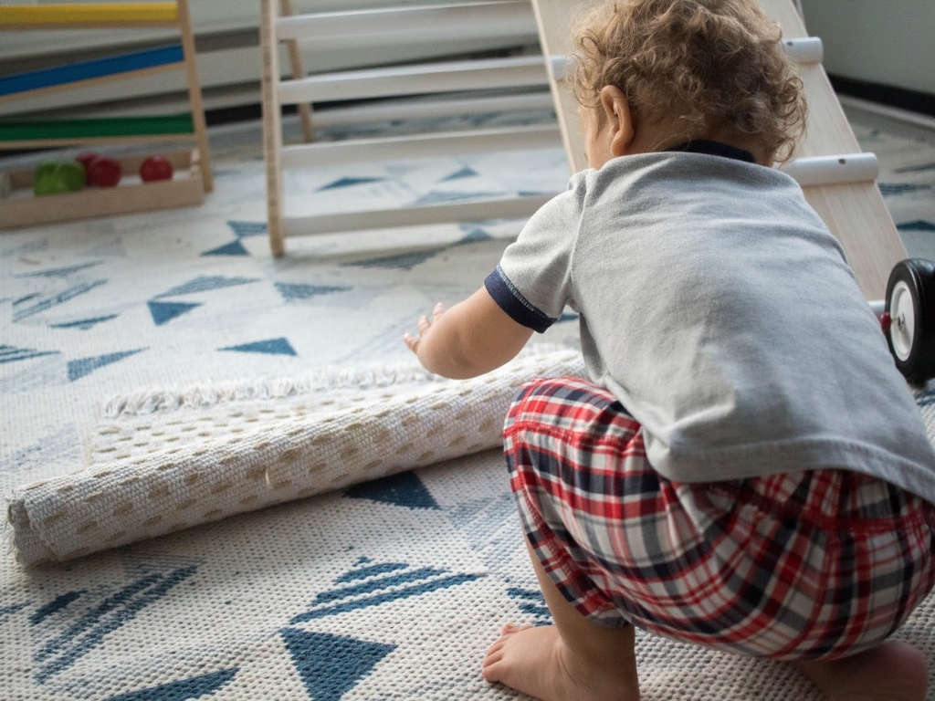 Montessori activity - rolling a rug