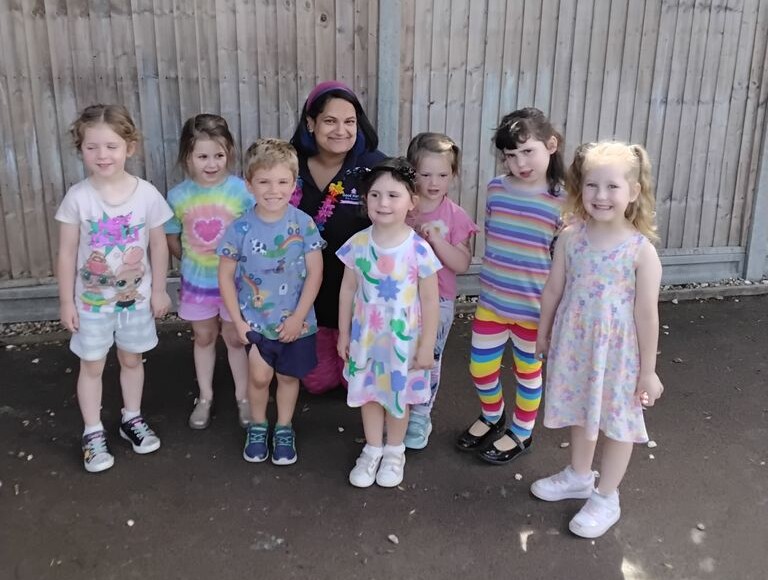 Children in rainbow themed clothes